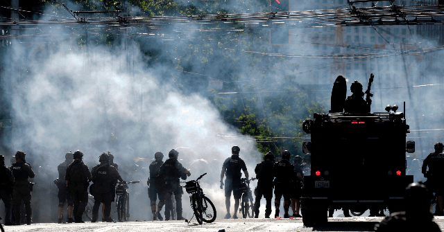 WATCH: Armed Rioters Corner, Fire at Police Vehicle in
Wisconsin 1