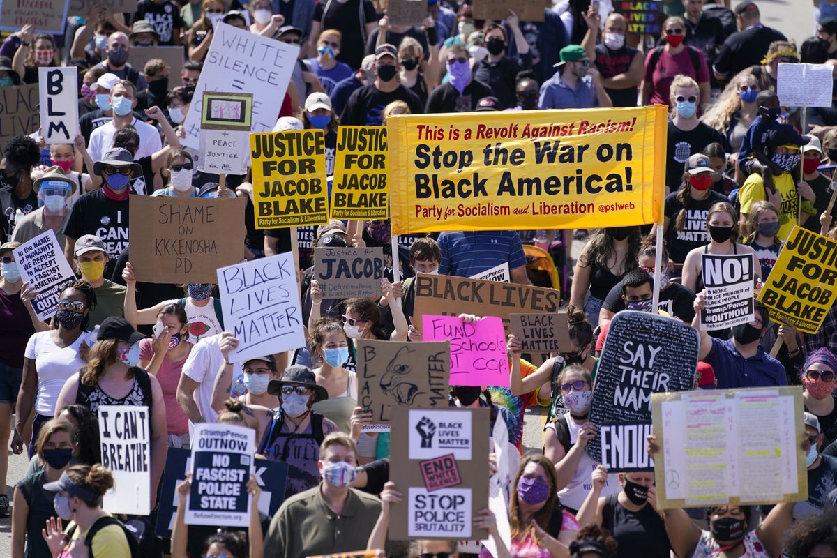 Protesters march for Jacob Blake in Kenosha: ’7 bullets, 7
days’ 1 Protesters march for Jacob Blake in Kenosha: ’7 bullets, 7
days’ 1