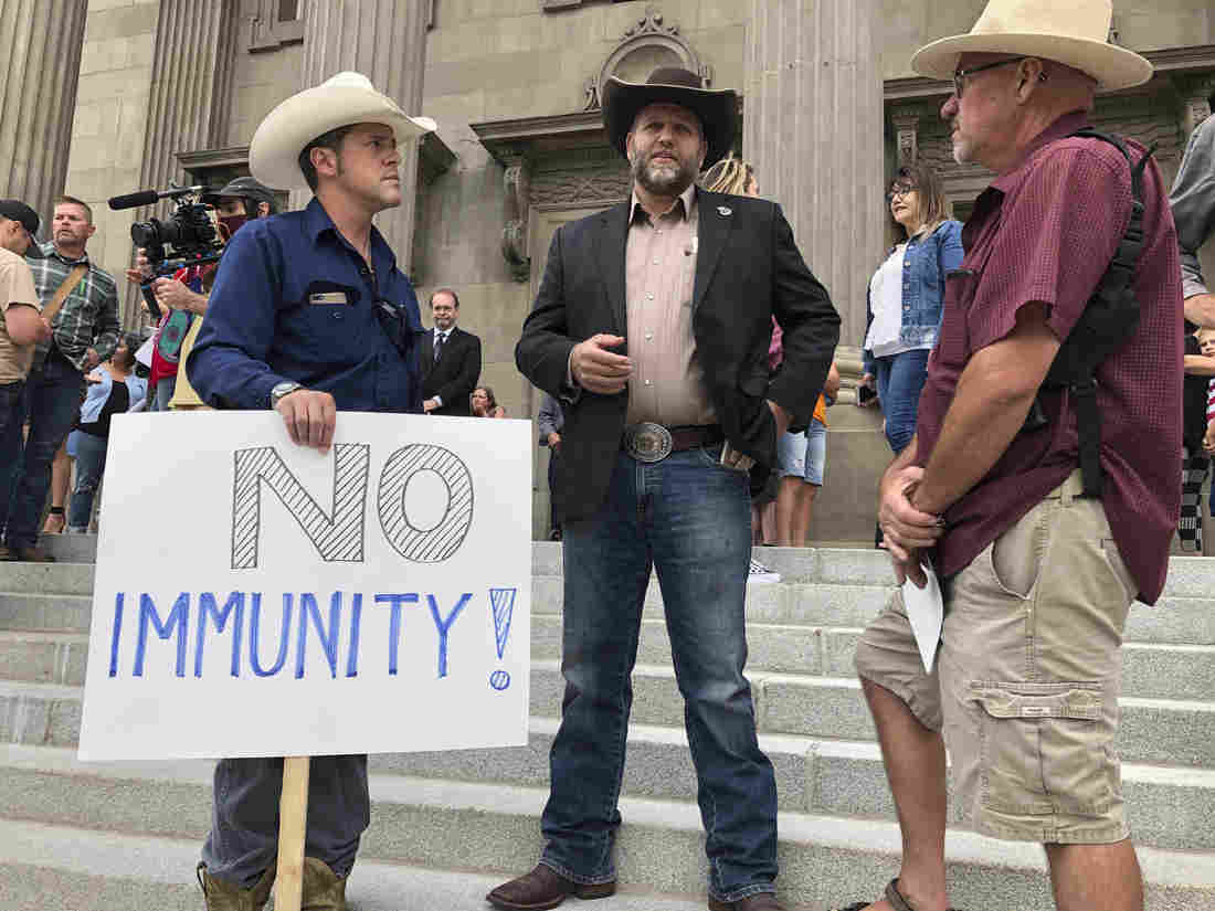 Unmasked Protesters Push Past Police Into Idaho Lawmaker's
Session 1