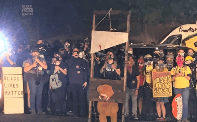 Wisconsin Cop Knocked Out With Brick After Shooting As
Portland Protesters Chant "Black Power" And Threaten Arson 1