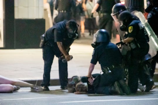 Detroit police arrest 42 people as protesters, authorities
clash after weeks of calm 1