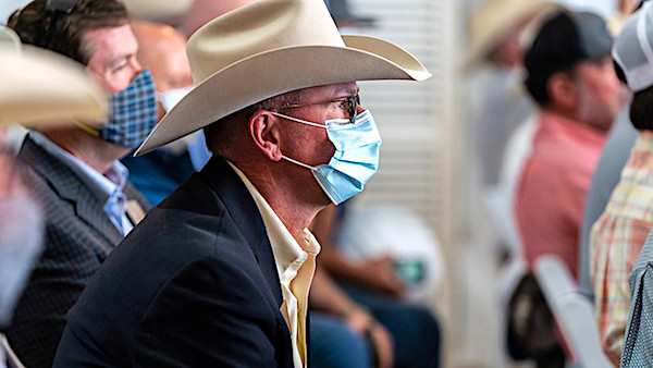 Texas '100% open' while Biden says wait another year 1