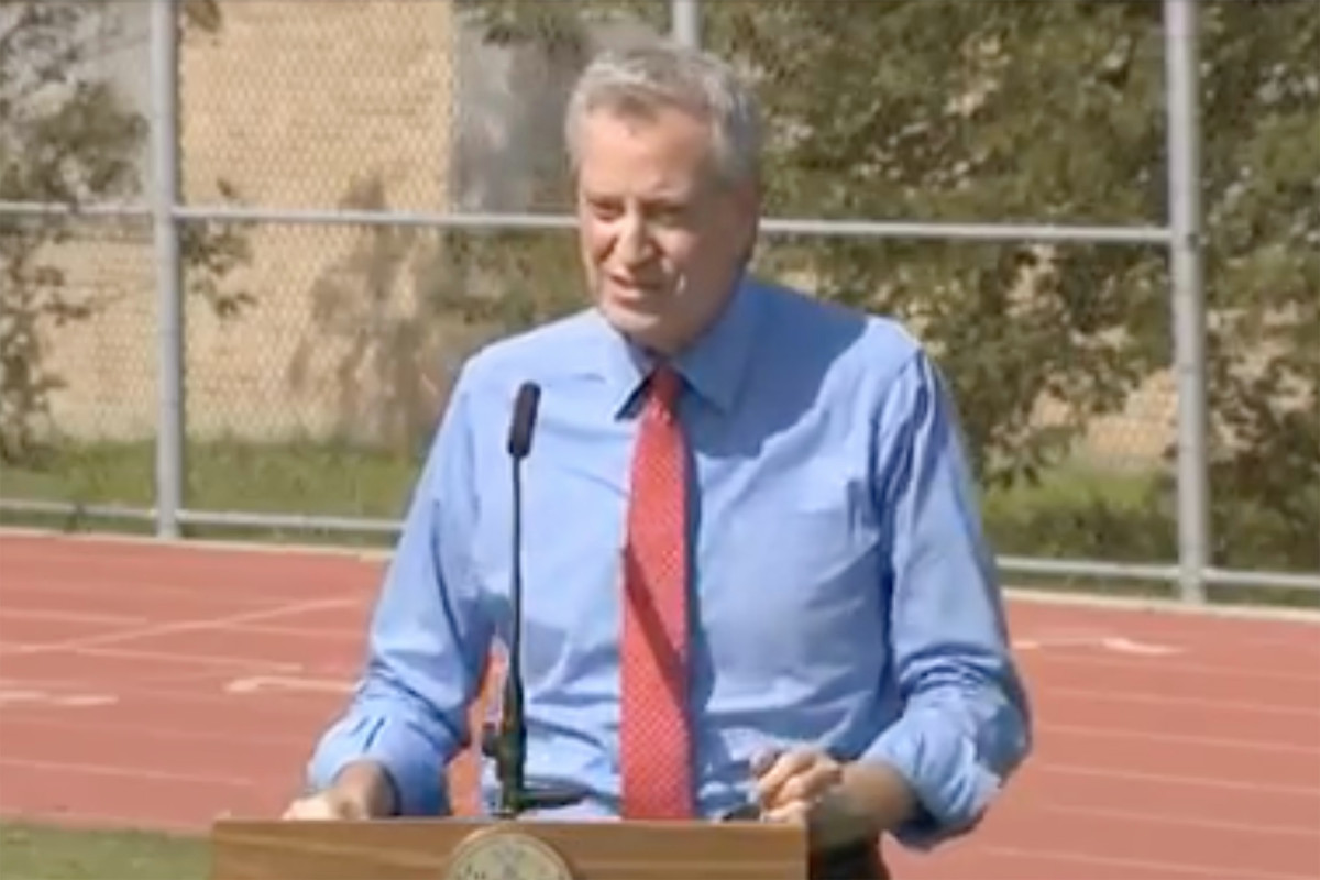 DOE assessing classroom airflow with toilet paper attached
to sticks 1