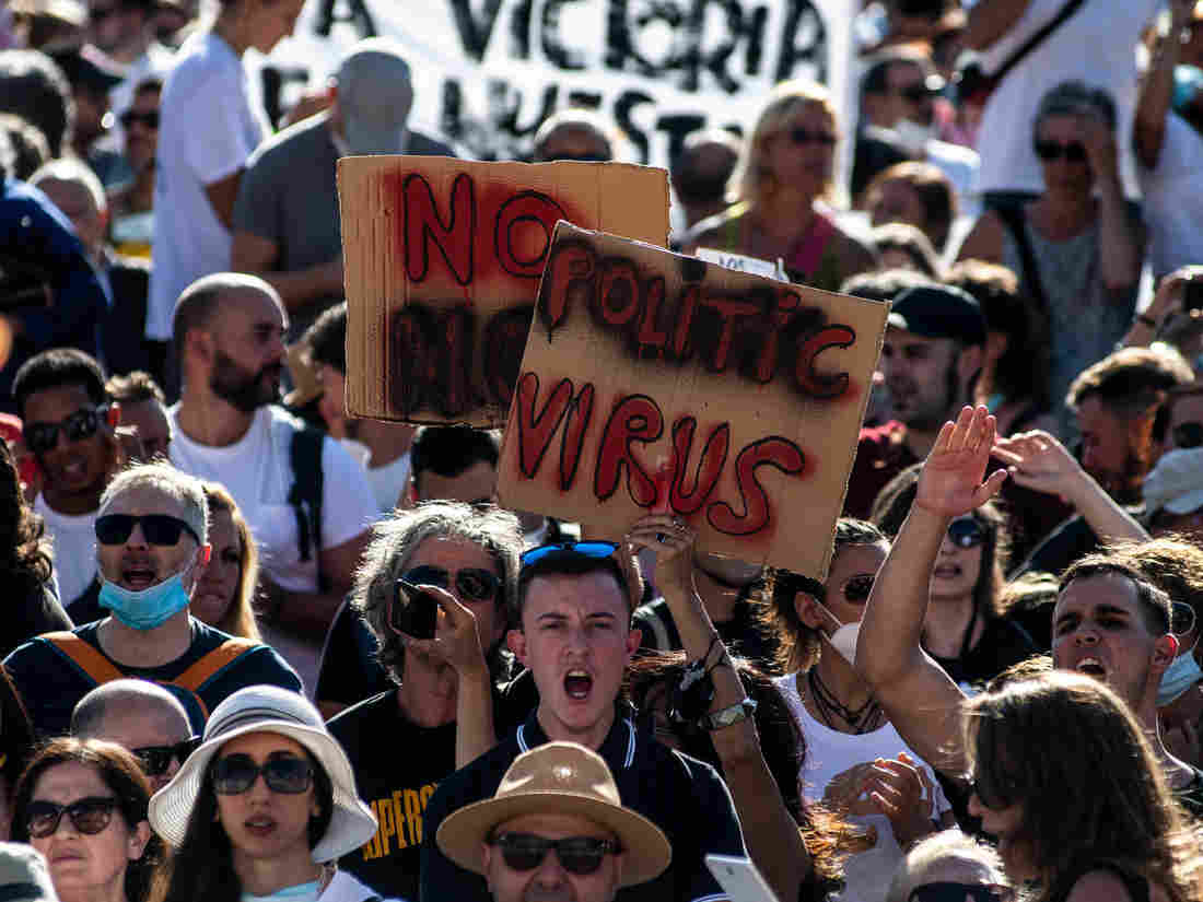 'We Can't Live Like Zombies': Protesters In Spain Decry
COVID-19 Mask Mandate 1