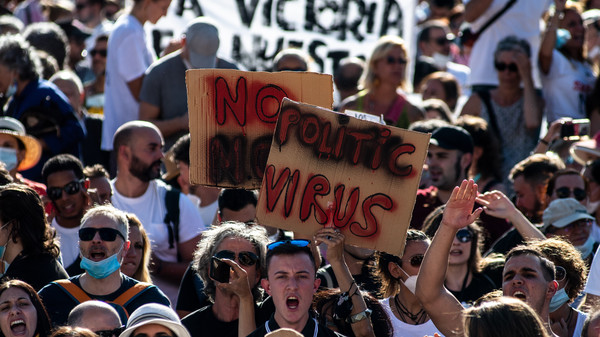'We Can't Live Like Zombies': Protesters In Spain Decry
COVID-19 Mask Mandate 1
