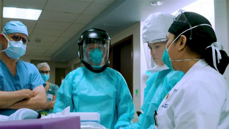 Hospital staff members say they can't get coronavirus tests,
are forced to reuse PPE 1