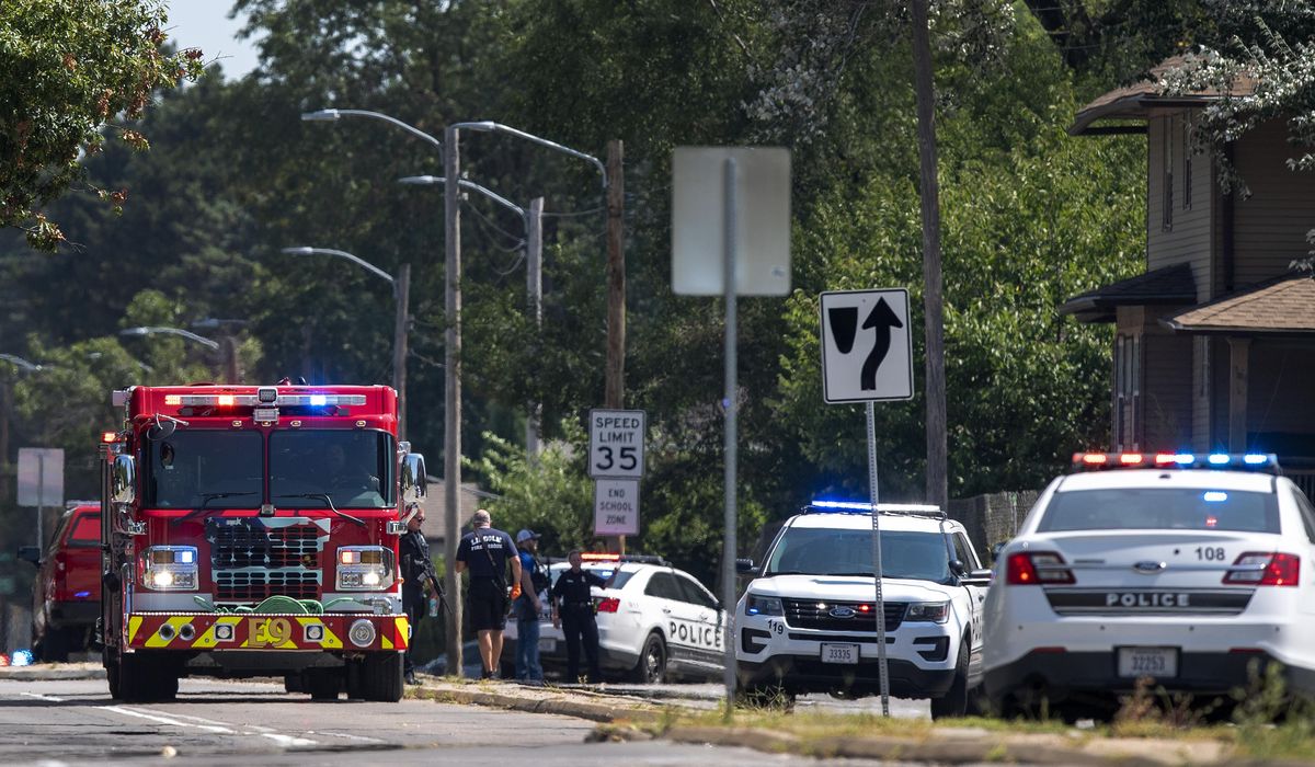 2 arrested in officer's shooting to be charged with
escape 1