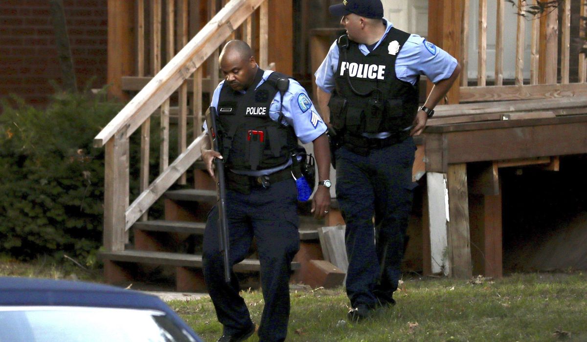 Gunman who shot 2 officers arrested after 12-hour
standoff 1