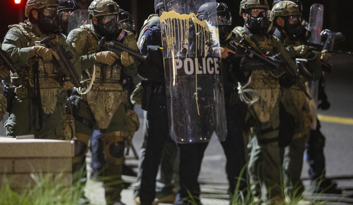 Portland riots intensify; balloons with feces thrown at cop
cars 1