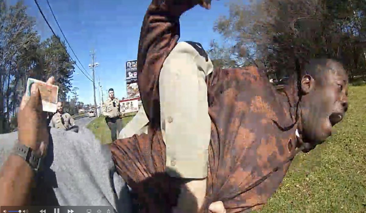 Officer denies wrongdoing in violent takedown of wrong
man 1