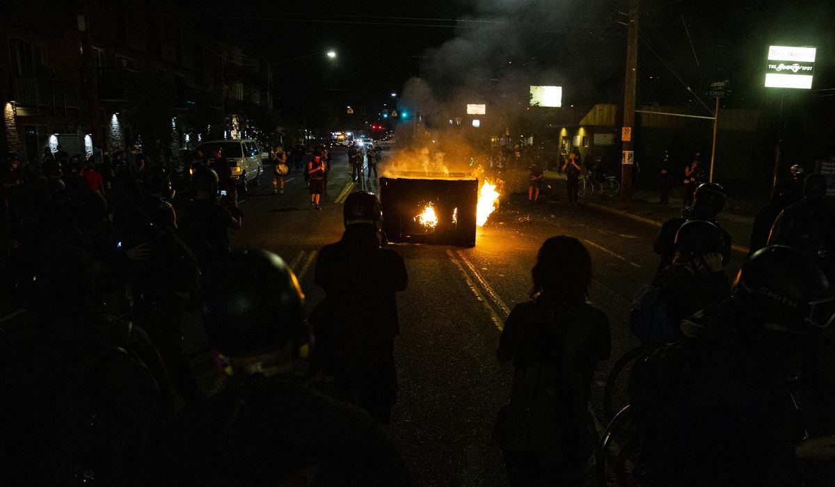 Protesters rally in Portland as mayor decries
violence 1 Protesters rally in Portland as mayor decries
violence 1