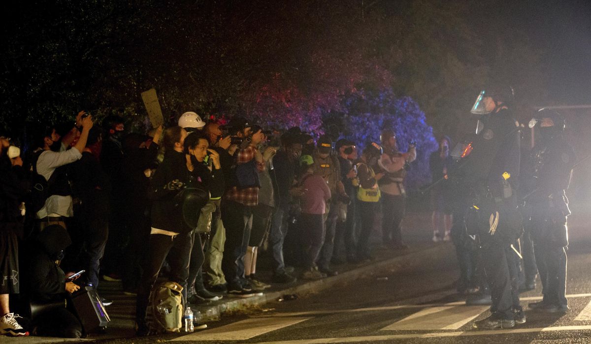 Portland protests persist as some bring flashes of
violence 1