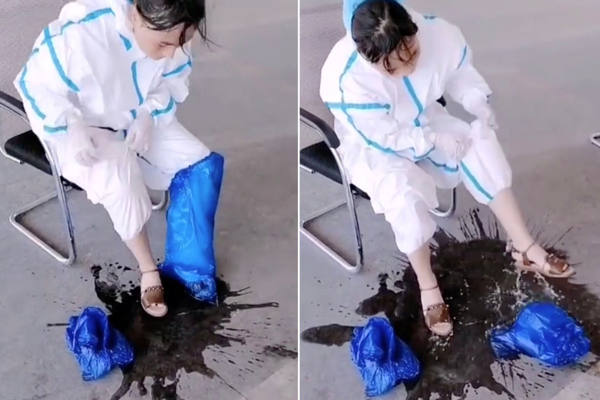 Chinese COVID-19 medic sweats buckets after working nonstop
in heat 1