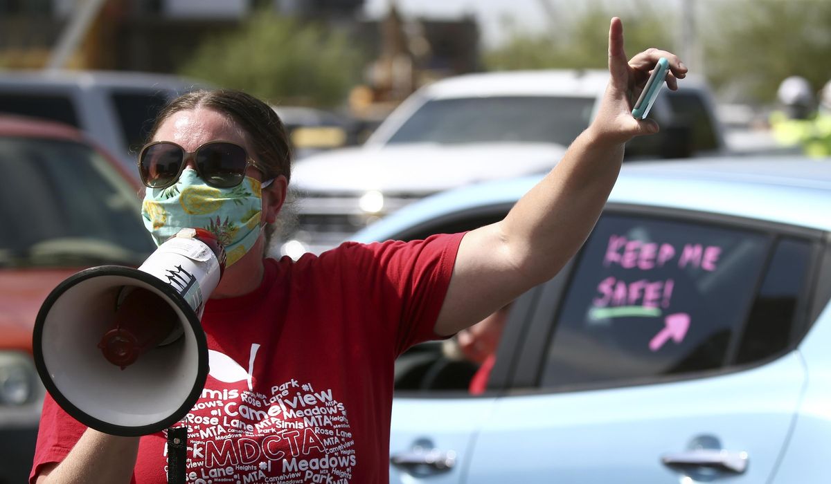 Arizona school district forced to close classrooms again as
teacher 'sickout' continues 1