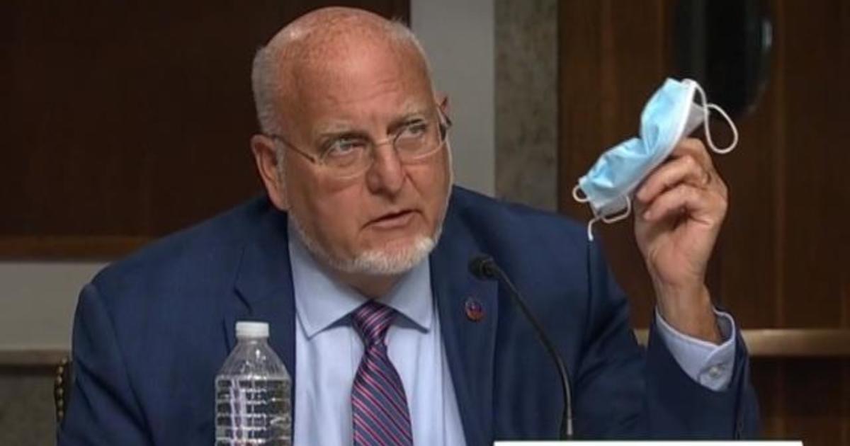 CDC director contradicts Trump on vaccine timeline and face
masks 1