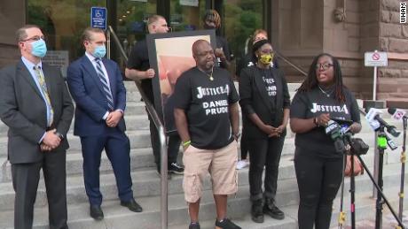 Family calls for officers' arrest in the death of a Black
man after they knelt on him 1