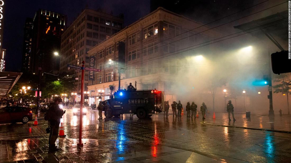 Man charged with stealing a police gun during Seattle
protests identified with the help of a YouTube video 1