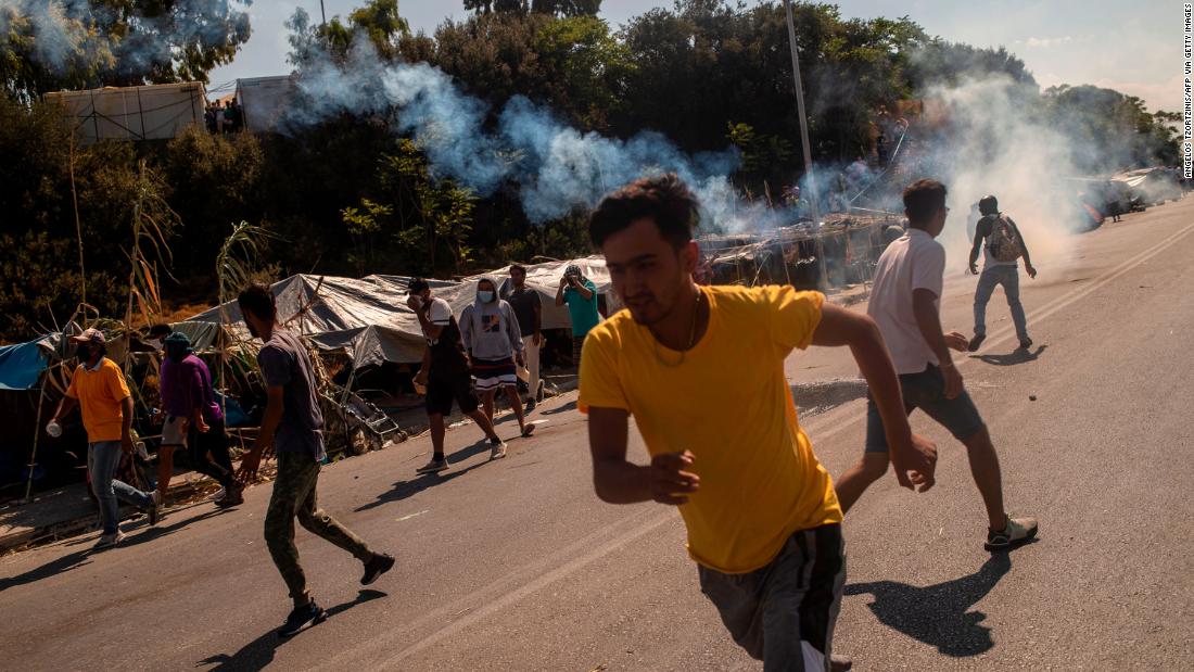 Greek police fire tear gas at protesting migrants after
refugee camp burned 1