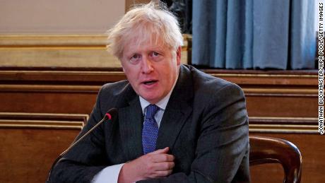 Boris Johnson's early Christmas present to Britain: Six
months of coronavirus gloom 1