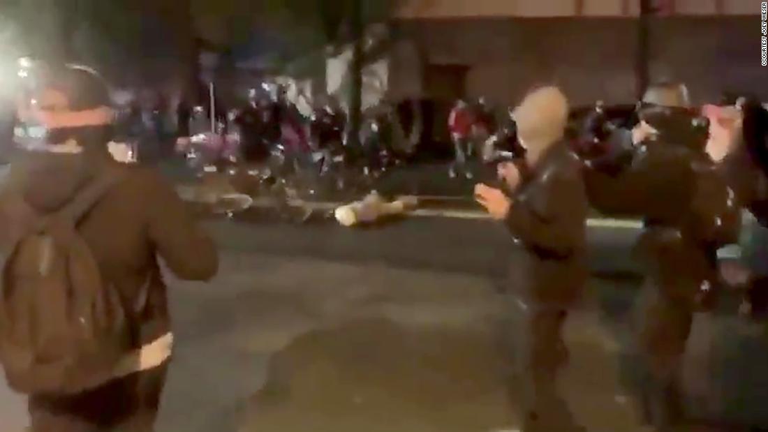 Police officer shown on video riding bike over a protester's
head placed on leave 1