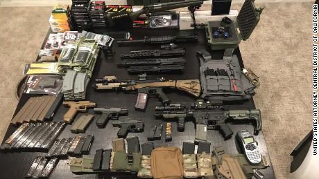 A man accused of driving into protesters is arrested for
illegal firearms and setting up 'training camp' at family
vineyard 1