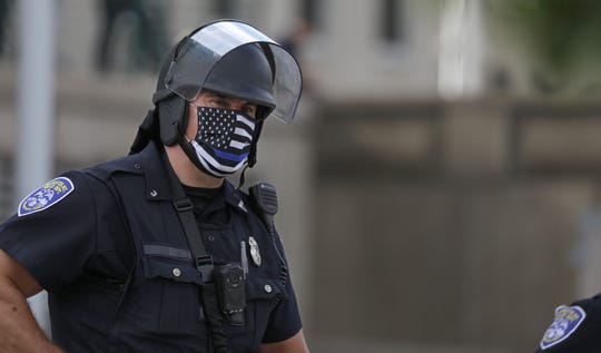 Can police officers cover their name tags? Rochester
department says yes, for officer safety 1