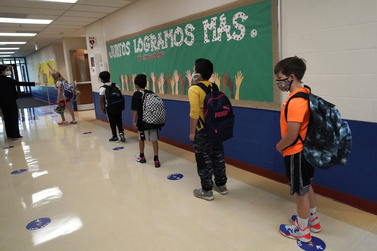 Suburban Chicago school districts begin a phased-in return
to the classroom (LIVE UPDATES) 1