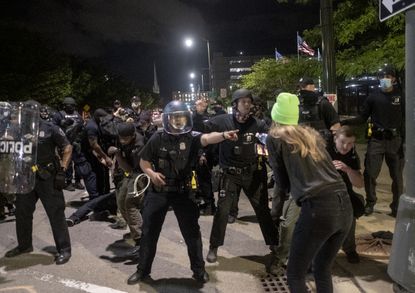 Judge bans officer use of tear gas, rubber bullets, other
police tactics against peaceful protesters in Detroit 1 Judge bans officer use of tear gas, rubber bullets, other
police tactics against peaceful protesters in Detroit 1