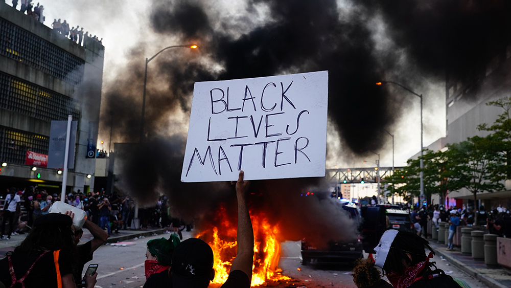 U-Haul trucks set ablaze by protesters owned by Black man
who placed 'Black owned' sign outside. He's livid 1