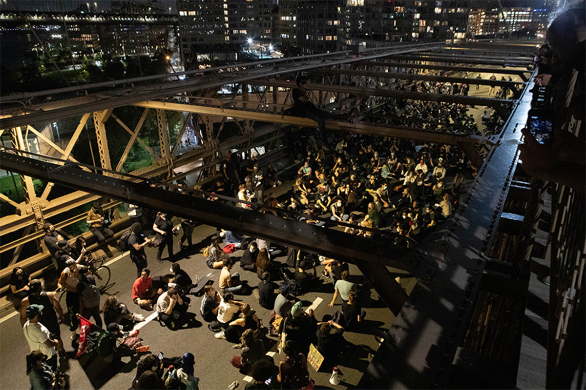 Hundreds of protesters stage ‘sit in’ at Brooklyn
Bridge 1