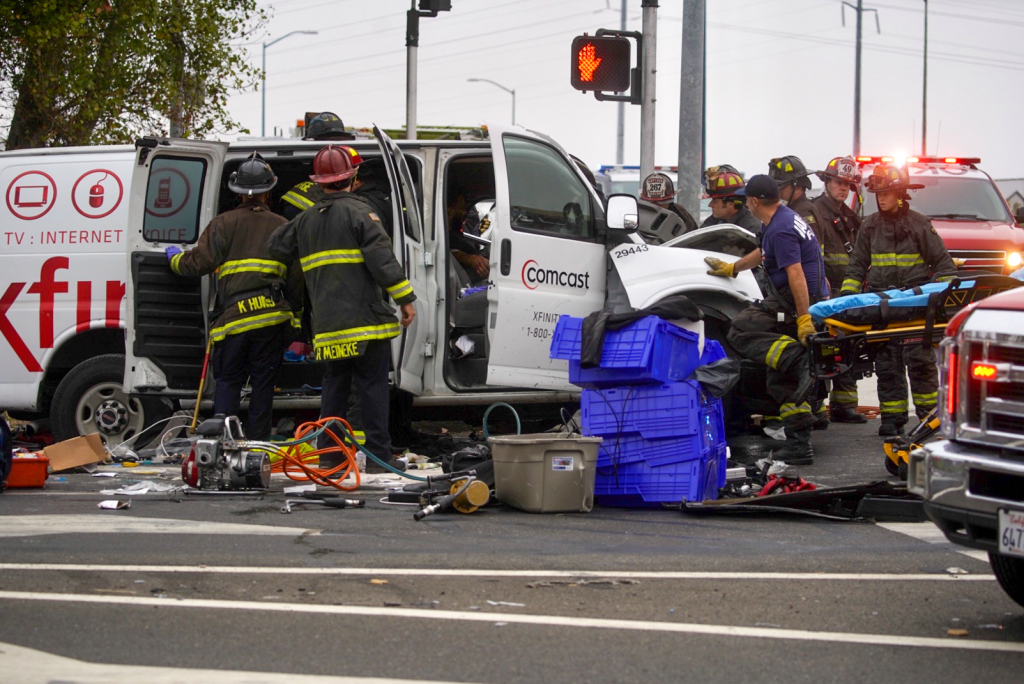 Driver extricated from burning crashed van after Oakland
police officers stop it from rolling, extinguish fire 1