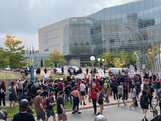Crowd demands “drop the charges” against Colorado police
protest leaders 1