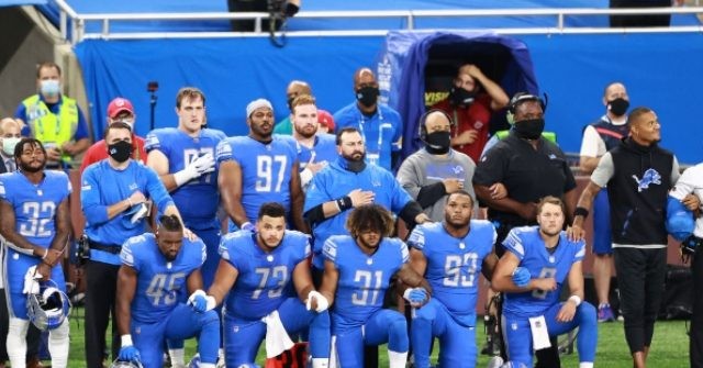 Dozens of Players and Staff from Bears, Lions Protest During
Anthem 1