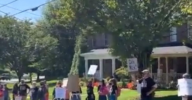 WATCH — Protesters Gather Outside McConnell's Home: 'Ruth
Sent Us' 1