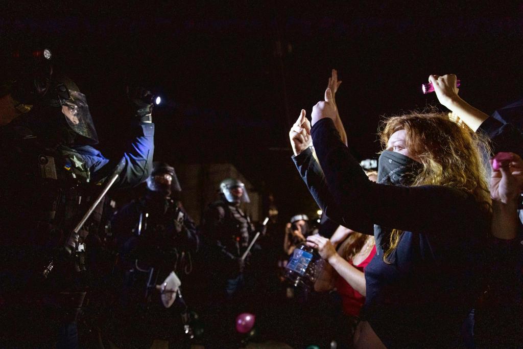 Dozens arrested as violent Portland protests
continue 1