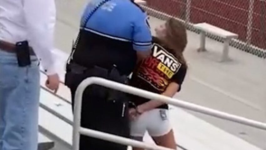 A police officer Tasered a maskless woman at a youth
football game. Then, police and schools were flooded with
threats. 1