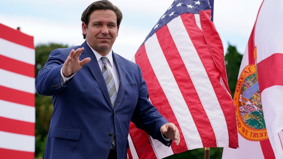 Florida governor reopening state's economy despite
spread 1