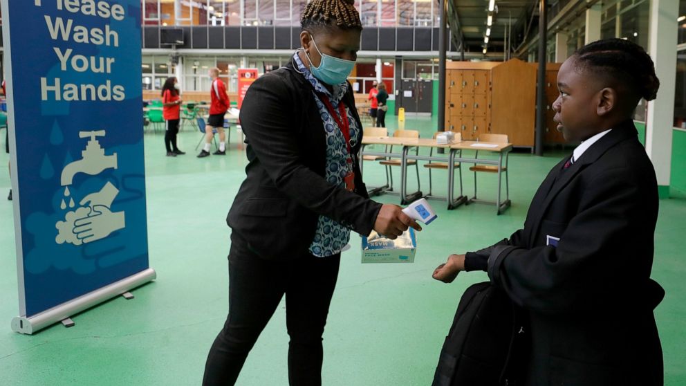 Hands up, masks on: High school students face whole new
year 1
