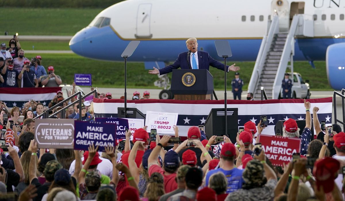 The Latest: Trump mocks the way Biden wears his mask 1