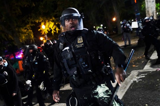 Portland police seize shields, arrest 24 before march; one
officer hospitalized 1