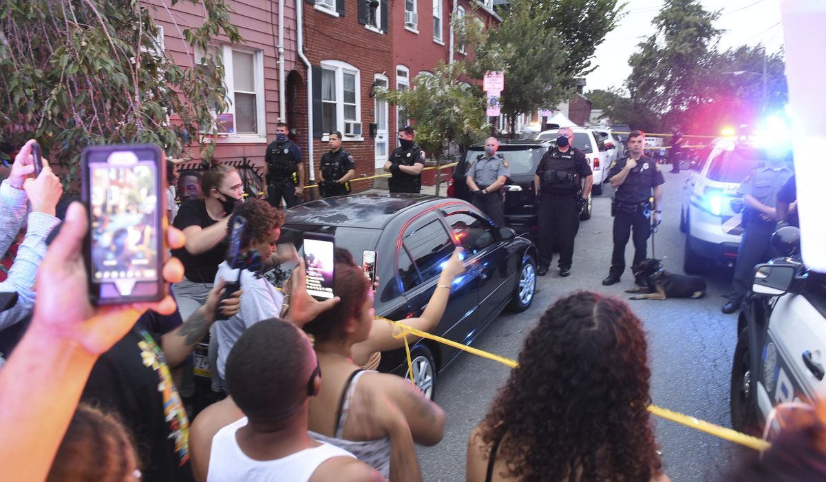 $1M bail cut for some held after protests of police
shooting 1