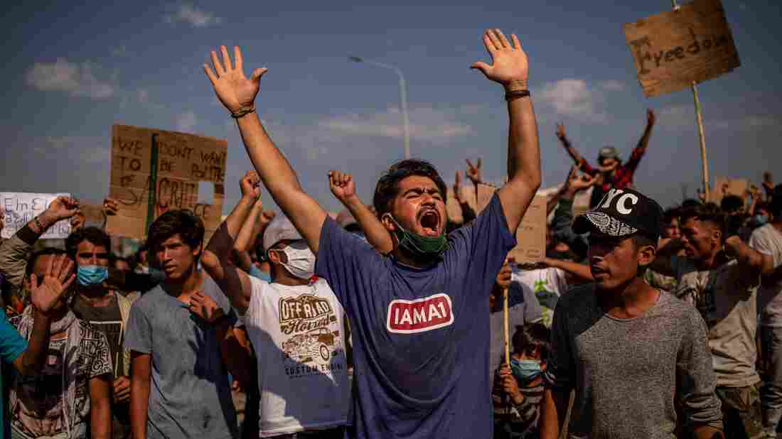 Police Fire Tear Gas At Refugees Protesting To Leave Greek
Island 1