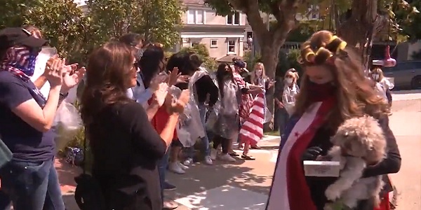 Protesters in hair curlers gather outside Nancy Pelosi's
house amid blowout backlash 1