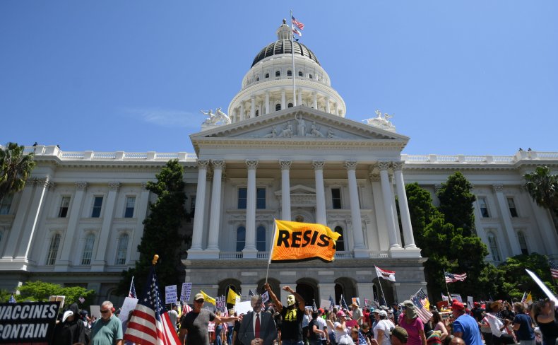 GOP State Leader Defies COVID Quarantine to Attend Church
Event Maskless With 12,000 People 1