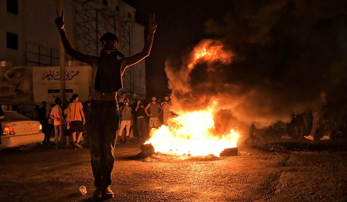 Officials say east Libya government resigns amid
protests 1
