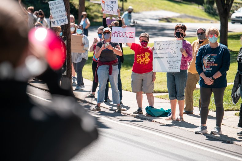 Protesters Gather Outside Mitch McConnell's Home to Decry
Move to Fill Supreme Court Seat: 'Ruth Sent Us' 1