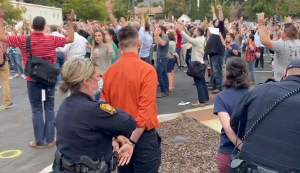 Christians arrested for singing maskless outside city
hall 1