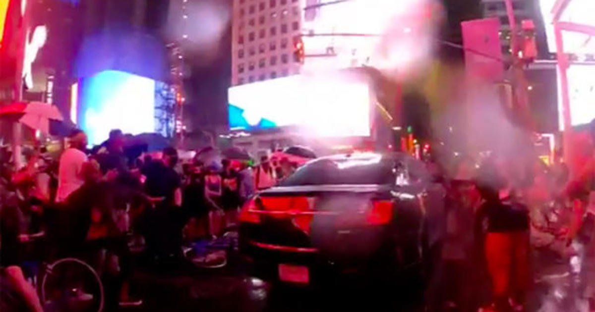 Car drives through Times Square protesters 1