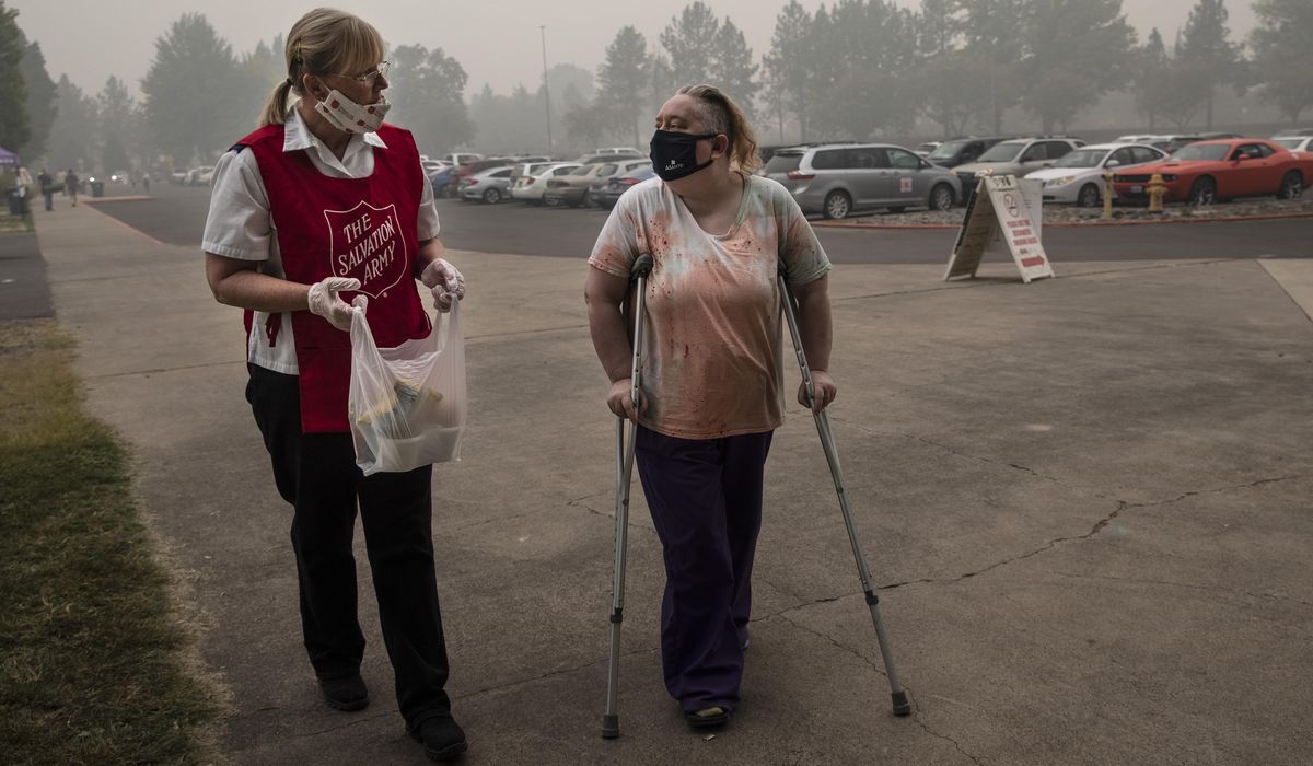 Coronavirus complicates wildfire evacuations on West
Coast 1