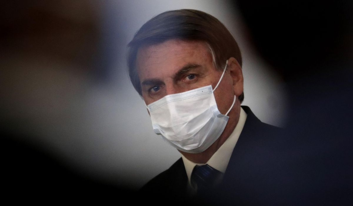 Brazil leader rapped for stirring doubt on COVID-19
vaccine 1